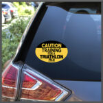 CAUTION Training For A Triathlon 70.3 Runner Decal or Car Magnet